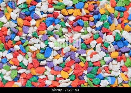 Many colored stone backgrounds are colored stones that are used in rock garden decorations or used to cover the soil surface in pots of cactus because Stock Photo
