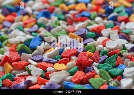 Many colored stone backgrounds are colored stones that are used in rock garden decorations or used to cover the soil surface in pots of cactus because Stock Photo