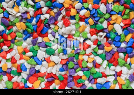 Many colored stone backgrounds are colored stones that are used in rock garden decorations or used to cover the soil surface in pots of cactus because Stock Photo