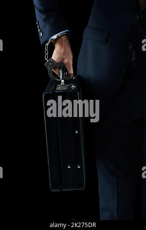 Getting the precious cargo there safely. Shot of an unrecognizable businessman with a briefcase handcuffed to his wrist. Stock Photo