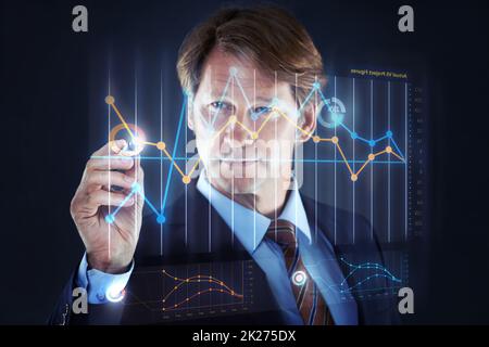 Technology making business easy. Cropped shot of a businessman writing on a hologram chart.All screen content is designed by us and not copyrighted by others, and upon purchase a user license is granted to the purchaser. A property release can be obtained Stock Photo
