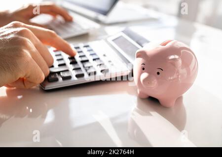 Businessman Doing Professional Accounting Using Calculator Stock Photo