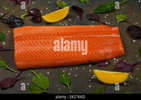 Raw salmon fish fillet on table Stock Photo