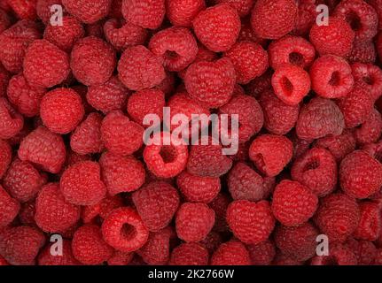 Background of fresh red ripe raspberry berries Stock Photo