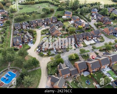 Aerial shot looking down on urban housing development - housing estate of mainly bungalows in Milton Keynes. Housing market, economic property prices Stock Photo