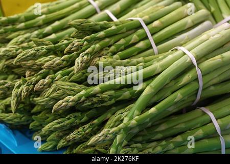 Heap of fresh green asparagus shoots close up Stock Photo