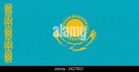 flaflag of Kazakhstan. National Kazakh flag on fabric surface. Fabric Texture Stock Photo