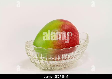 ripe and labeled organic mango Stock Photo