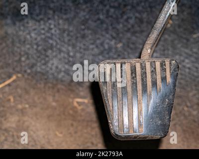 An old car gas pedal with a rubber pad. Stock Photo