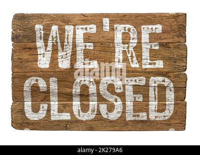 Wooden retro sign on a white background - We are closed Stock Photo