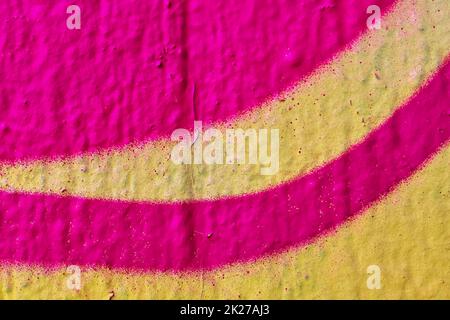 Detailed and colorful close up at cracked and peeling paint on concrete wall textures in high resolution Stock Photo