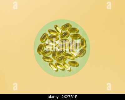 Vitamin D3 or Omega capsules, flat lay Stock Photo