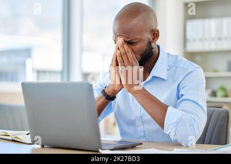 Stress, anxiety and tired businessman with a laptop suffering from burnout while frustrated, fail and mistake in the office. Entrepreneur suffering Stock Photo