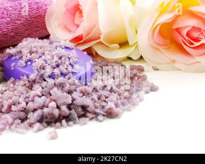 Hand-made soap and sea salt  on grey bamboo mat Stock Photo