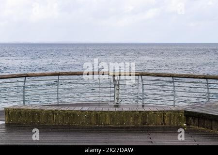 Niendorf, Germany - 30.January 2022: View of the stormy Baltic Sea at a pier in Niendorf on Timmendorfer Strand. Stock Photo
