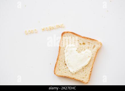 sandwich for breakfast in form of heart with cheese - good morning inscription Stock Photo