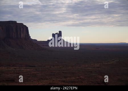 The dark colors of the Monument Valley during a sunset of a rainy day Stock Photo