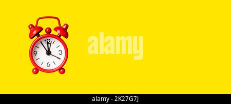 Banner with red retro alarm clock on yellow background. Time management, deadline concept. Copy space. High quality photo Stock Photo