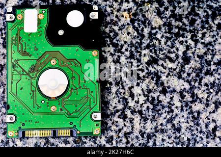 Internal hard drive for storing information on a black white marble surface Stock Photo