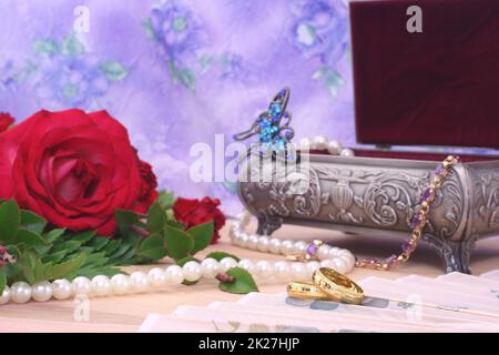 Red Roses with Wedding Bands and Jewelry Box Stock Photo