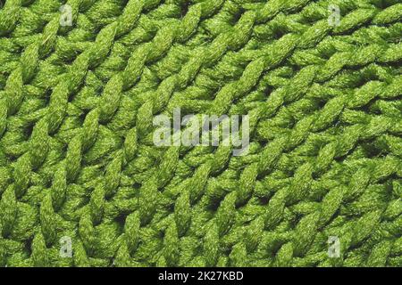 Knitted background close up. green woolen fabric Stock Photo