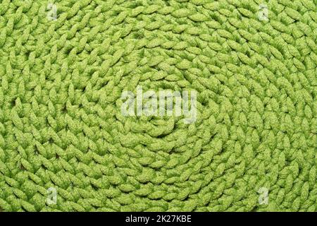 Knitted background close up. green woolen fabric Stock Photo
