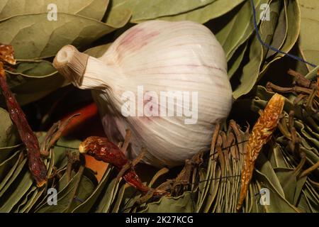 Garlic and bay leaves. dried hot peppers Stock Photo