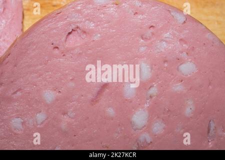 Boiled sausage slice close up. ham background Stock Photo