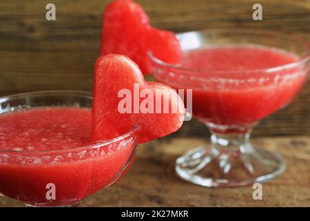 Healthy watermelon smoothie with of watermelon in heart shape on a wood background Stock Photo
