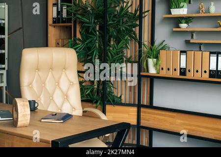 Modern office of general manager, businessman, ceo. Stylish wooden table, leather chair, interior. Workplace, workspace of accountant, financial direc Stock Photo