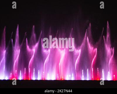 Beautiful fountain dancing show with reflection on water at night Stock ...