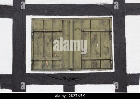 Old shutters in a half-timbered house Stock Photo
