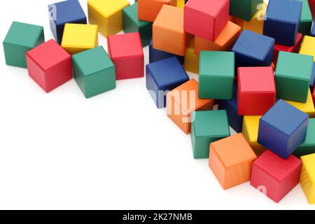 frame of colorful wooden building blocks on a white background Stock Photo