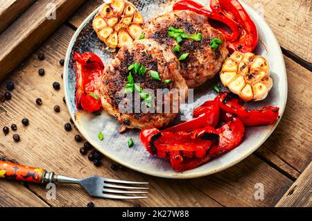 Fried beefsteak in bacon Stock Photo