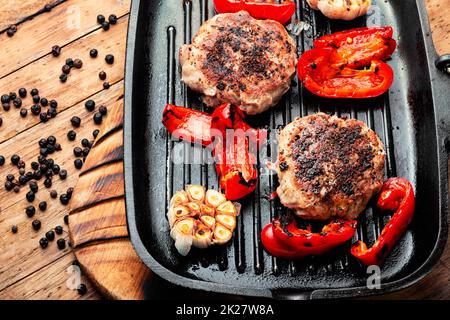 Fried beefsteak in bacon Stock Photo
