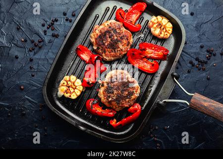 Fried beefsteak in bacon Stock Photo