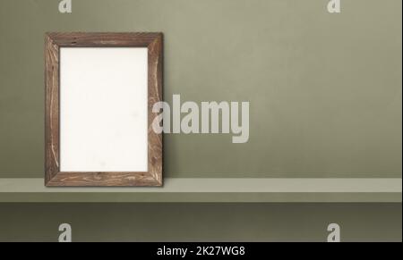 Wooden picture frame leaning on a green shelf. 3d illustration. Horizontal banner Stock Photo