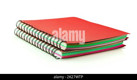 two red diary spiral notebookes isolated on white background Stock Photo