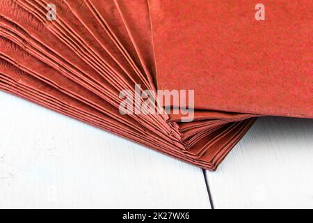 red napkins on a white wooden dinner table close up Stock Photo