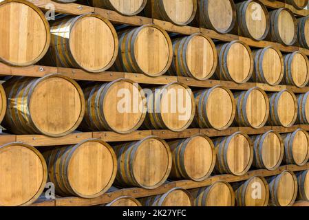 Wooden barrels in the wine cellar Stock Photo