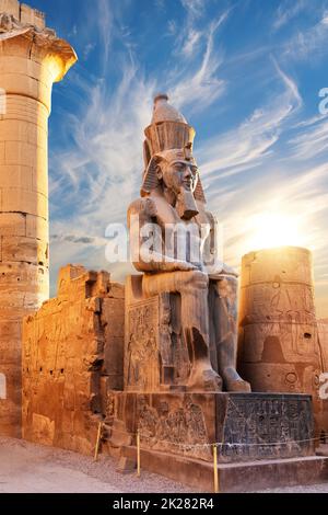 Seated statue of Ramesses II by the Luxor Temple entrance, Egypt Stock Photo