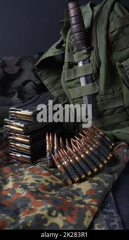 Photo of 5.56mm ammunition, machine gun bullets belt, rifle ammunition in magazines Stock Photo