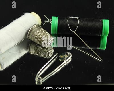 Sewing Needle thread scissors thimble tailor buttons Stock Photo