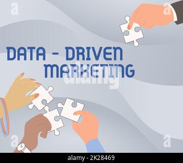 Handwriting text Data Driven Marketing. Internet Concept Strategy built on Insights Analysis from interactions Illustration Of Hands Holding Jigsaw Puzzle Pieces Helping Each Others. Stock Photo