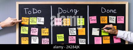 Group Of People Writing On Sticky Notes Stock Photo