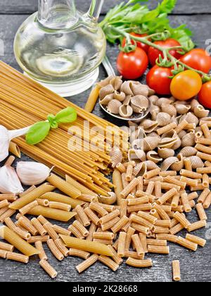 Pasta different whole grain and rye on board Stock Photo