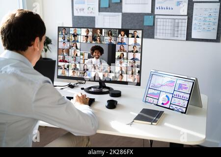 Online Video Conference Virtual Meeting On Multiple Screens Stock Photo