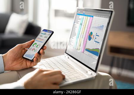 Man Using Spreadsheet Data Stock Photo