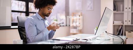 Taking Document Picture Or Photo With Phone Stock Photo