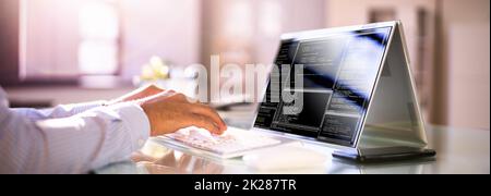 Programmer Or Coder At Office Desk Stock Photo